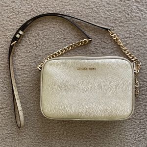 Micheal Kors gold cross body bag